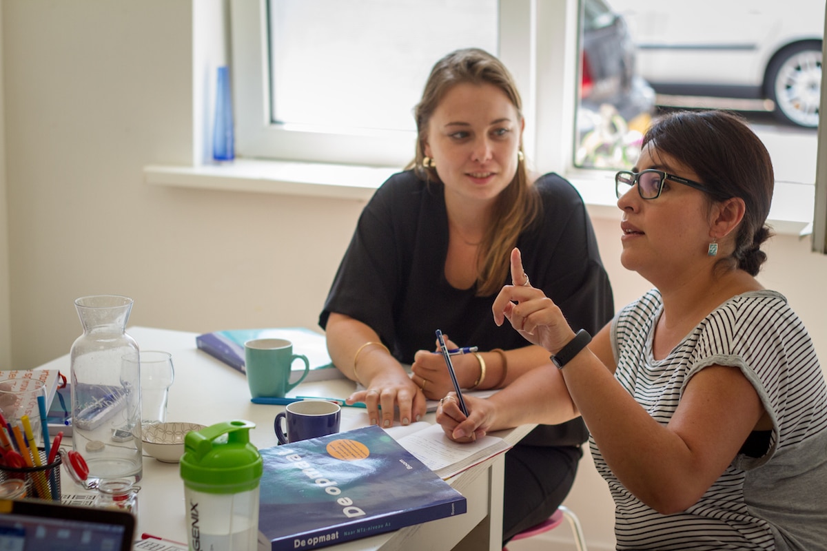 Students practising conversation in a communicative language lesson