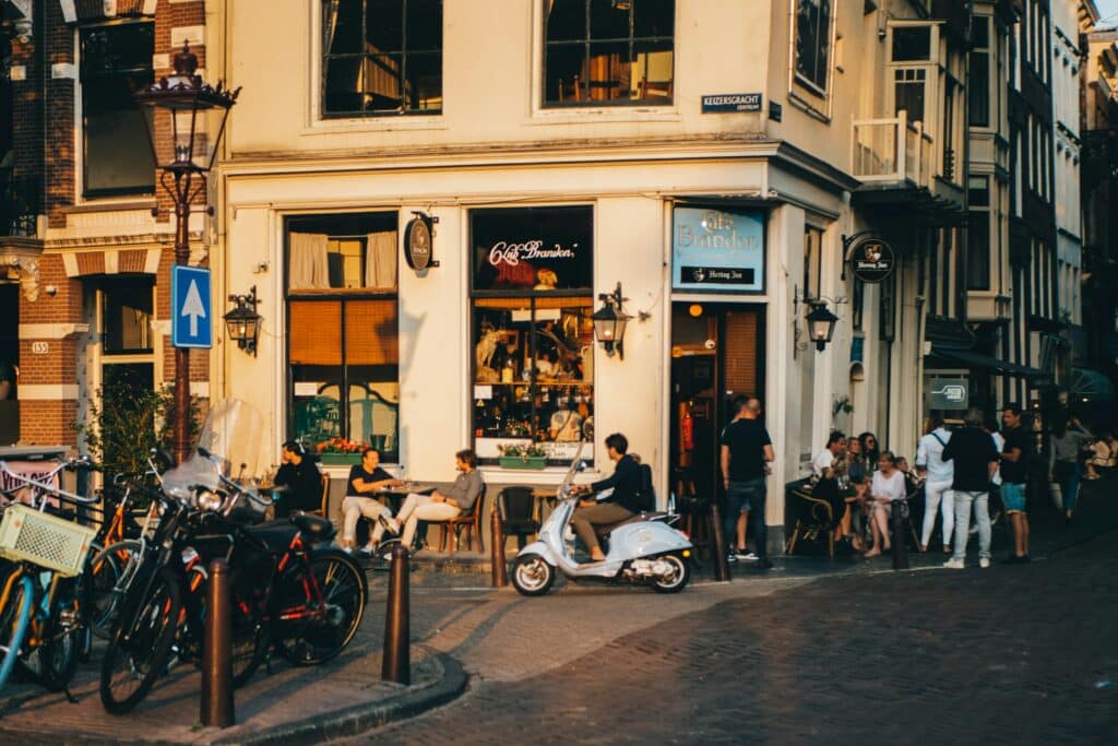 people in front of cafe in Amsterdam