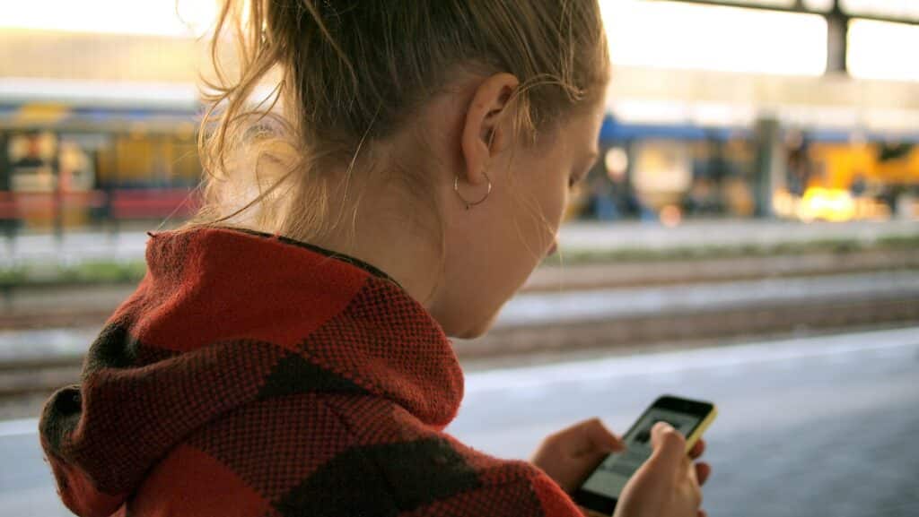 person using smartphone person using smartphone in Dutch