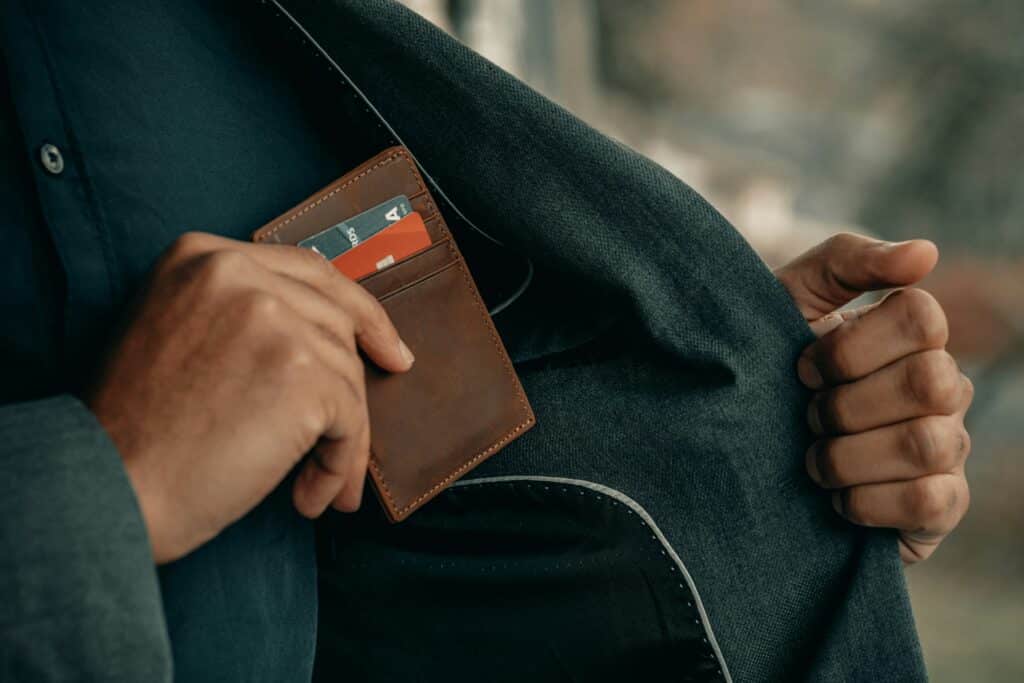 person holding bank cards English is needed for bank transactions in Amsterdam