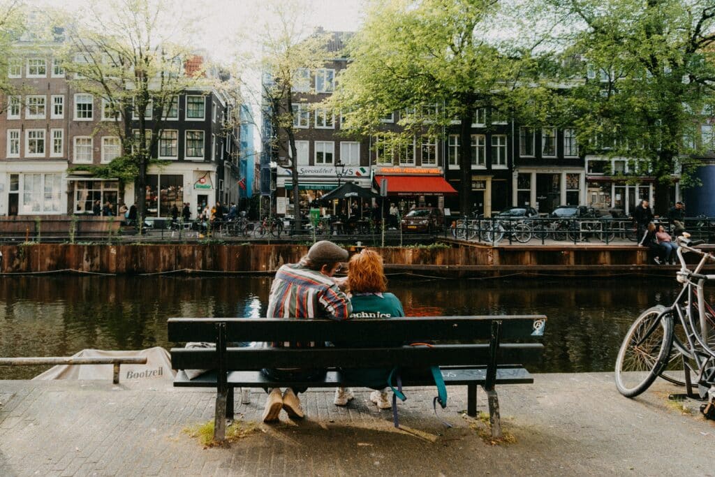 locals sitting on a bench in Amsterdam